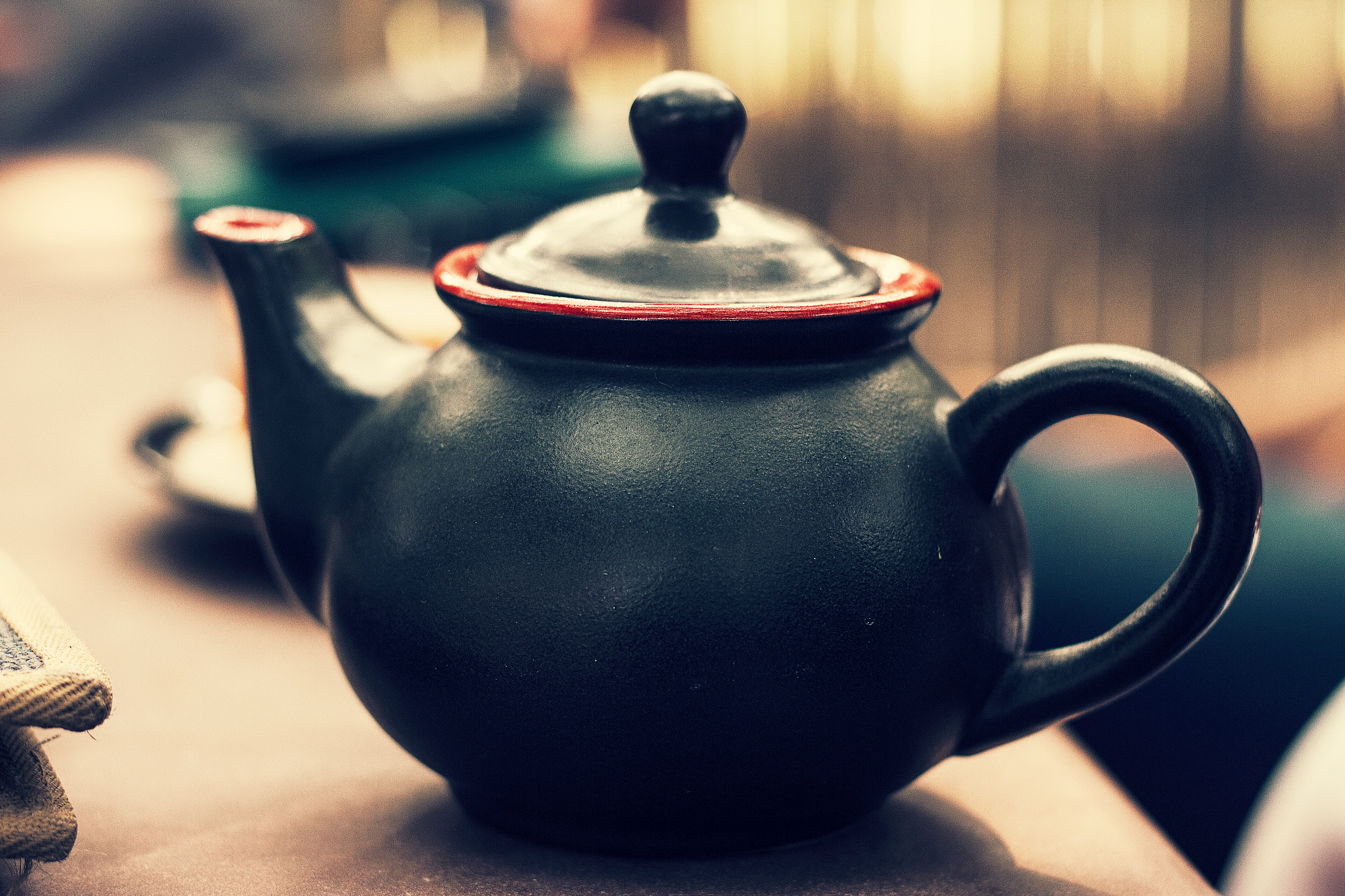 Minimalist teapot with wooden handle